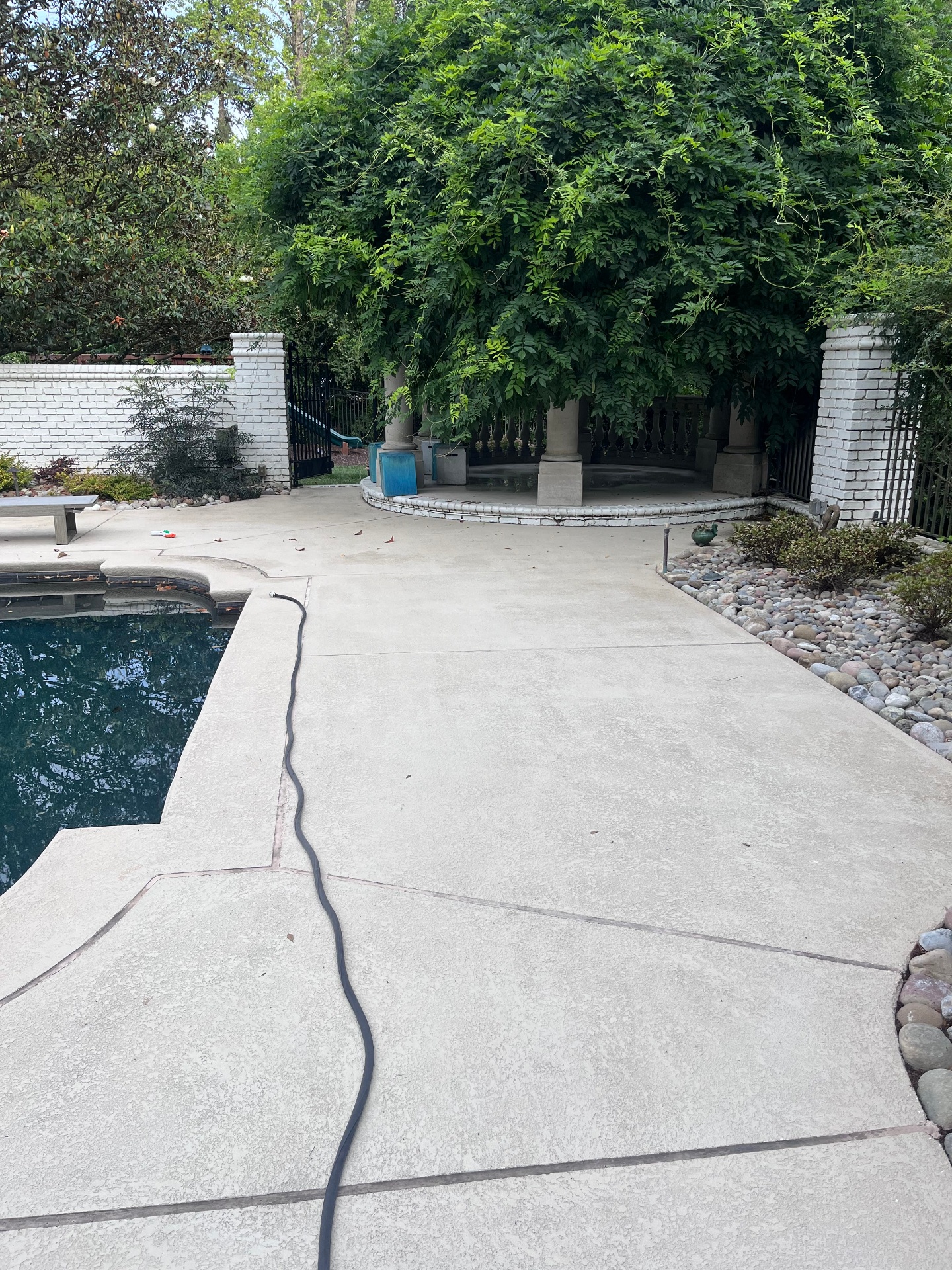 Clean concrete pool deck and patio area
